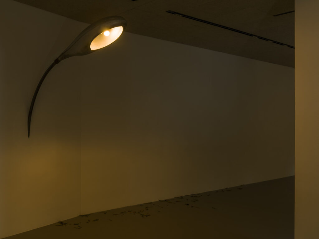 Street light installed on exhibition space wall.