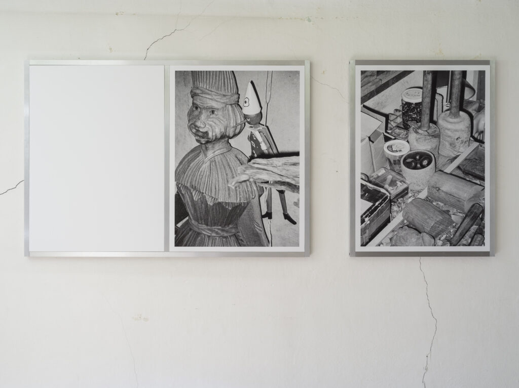 Installation view of black and white photographs.