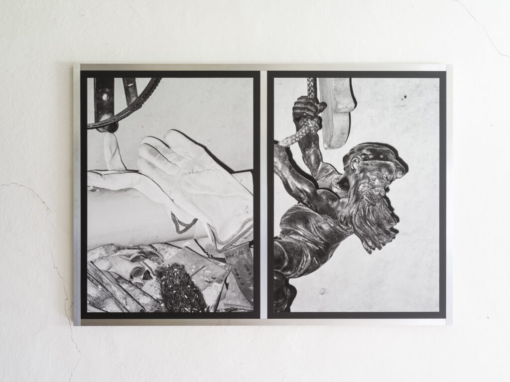 Installation view of black and white photographs.