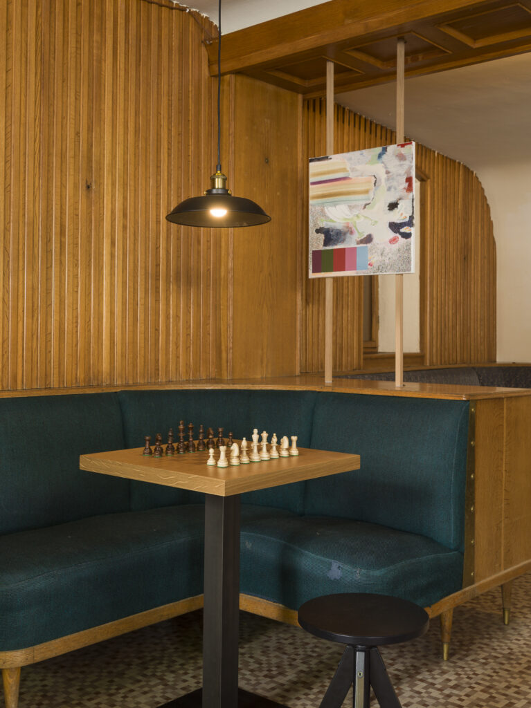 Installation view of the exhibit, tables, stolls and lights.