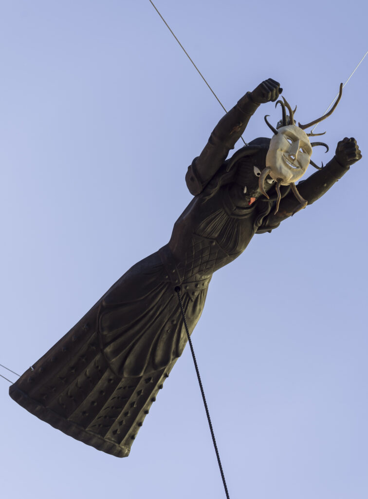 Installation view of a flying sculpture, installed between the roofs of Ortisei.
