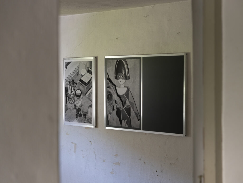 Installation view of black and white photographs.