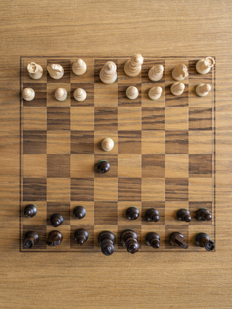 Installation view of the exhibit, tables with integrated chess board.