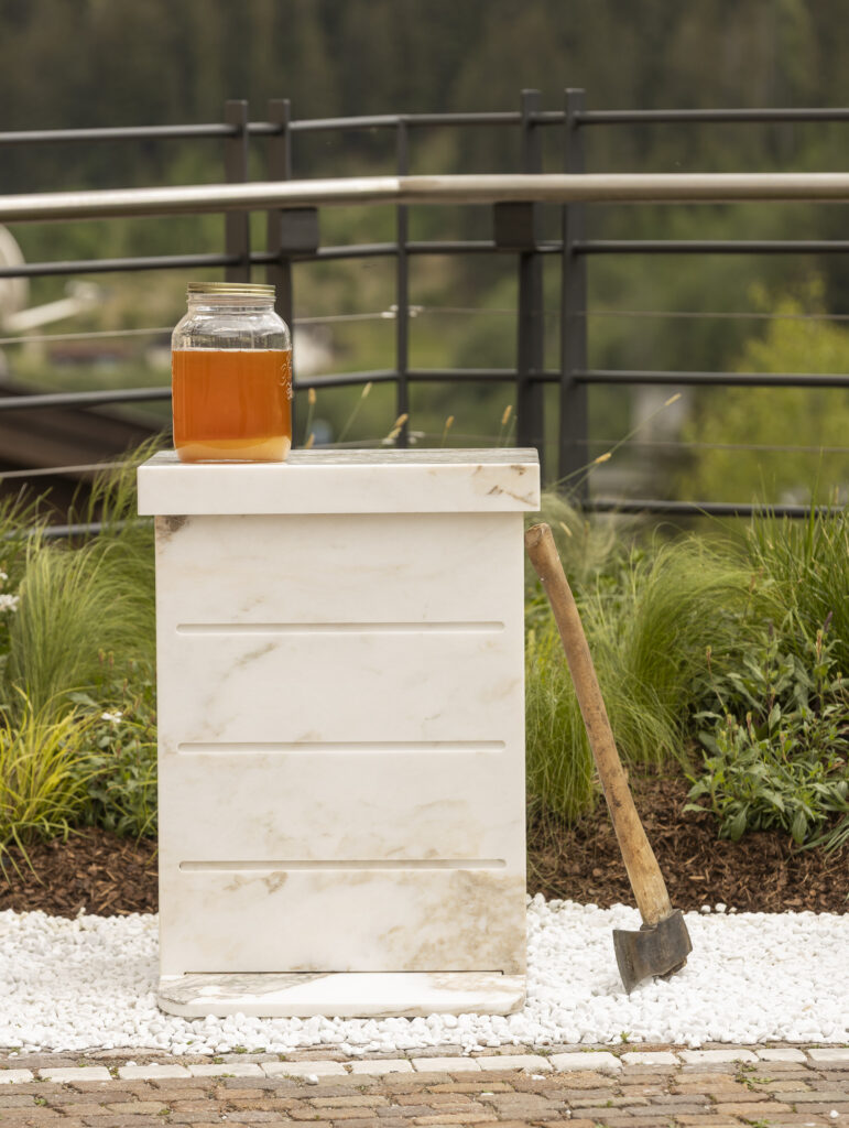Installation view of a marbel bee hive on a open Piazza.